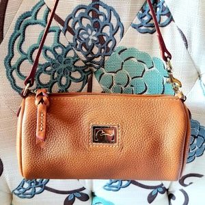 Pebble grain leather Dooney & Bourke barrel bag.